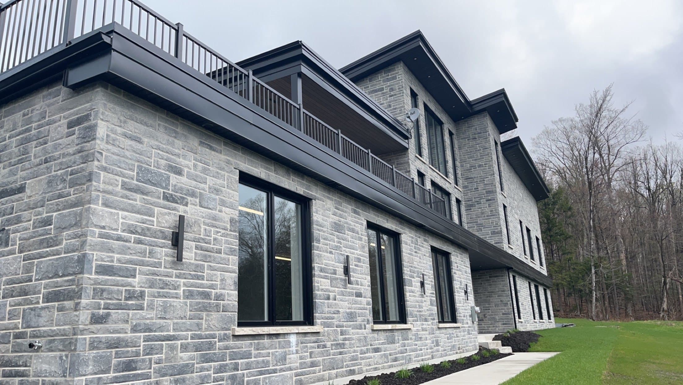 Large new house with flat roofs and balconies